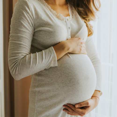 a pregnant woman who has just had reflexology treatment in Cardiff